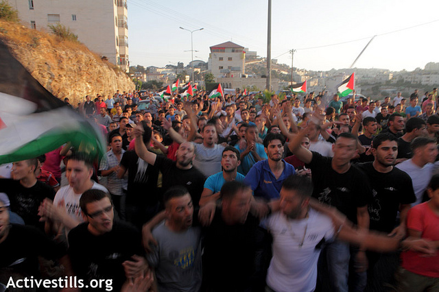 Palestinians march in the West bank city of Bethlehem to protest the rising cost of living, especially fuel and food, and calling for the resignation of the Palestinian National Authority's Salam Fayyad and an end to the neoliberal economic policies, September 10, 2012. Protesters condemned continuous increases in taxes, cuts to public sector wages and the oppressive rule of the Paris Protocol on Economic Relations, an agreement signed with Israel in 1994, which laid out the economic relations between Israel and the PA within the Oslo framework, and which turned out to be mostly about ensuring Israel's economic domination of the Palestinian market and has prevented the development of an independent Palestinian economy. (photo: Anne Paq/Activestills.org)