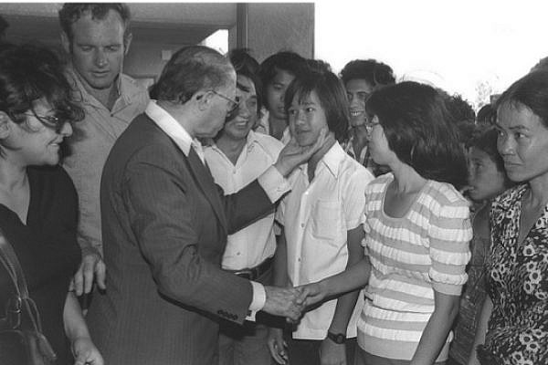 Menachem Begin greeting Vietnamese refugees given Israeli citizenship (photo: GPO)