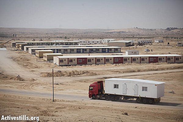 A mobile home unit is transported into the new prison facility under construction near the current Saharonim Prison in the Negev Desert, near Kadesh Barnea,  October 10, 2012. Israel is building a new facility that could hold thousands of additional asylum seekers. (photo: Oren Ziv/ Activestills.org)