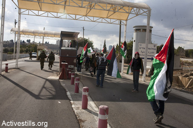 Photos: Palestinians protest occupation, block roads throughout West Bank