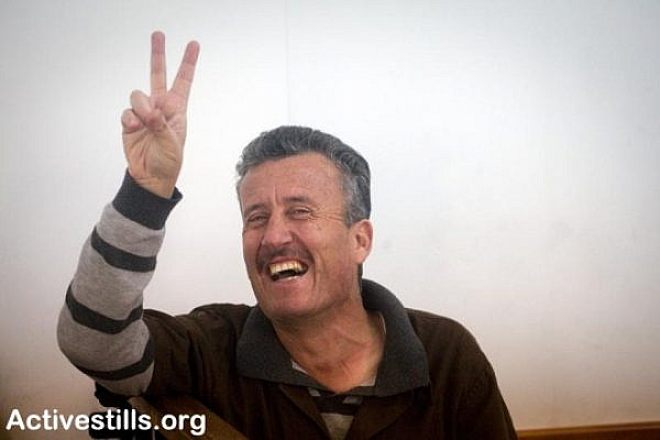 Bassem Tamimi, coordinator of the Nabi Salih popular committee, is seen inside a court room in the Israeli military offer camp, just before his hearing on the 12/4/2011.
Photo by: Oren Ziv/ Activestills.org