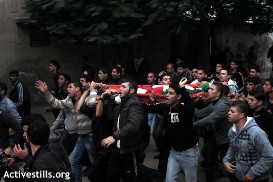 Photos: Gazans mourn victims of latest Israel strikes