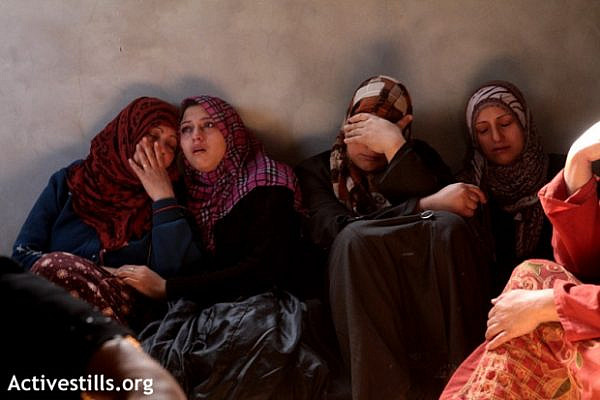 Palestinian women mourning the death of Mahmoud Raed Saddllah, a 4-year-old child, killed in an explosion in Jabaliya, Gaza strip, November 16, 2012. (photo: Anne Paq/Activestills.org)