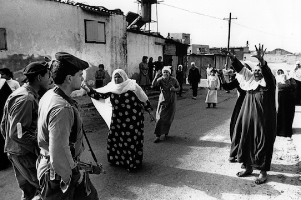 Palestinian women at the Jabaliya refugee camp in the Gaza Strip confront Israeli soldiers over the mistreatment and arrest of Palestinian youths. (photo: Robert Croma / CC BY-NC-SA 2.0)