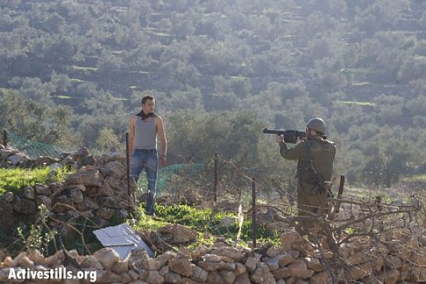 Illustration: Soldier aiming grenade launcher directly at demonstrator, Nabi Saleh (Yotam Ronen / ActiveStills)