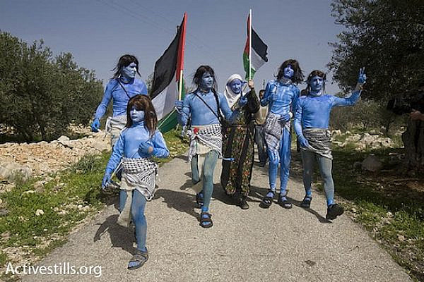 Anti-occupation activists dress up as characters from the film "Avatar" during a demonstration against the separation wall in Bil'in. (photo: Oren Ziv/Activestills)