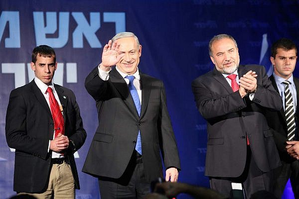 Binyamin Netanyahu and Avigdor Lieberman thank their supporters at the Likud-Israel Beitenu headquarter, January 23 2013 (photo: Yotam Ronen / Activestills)