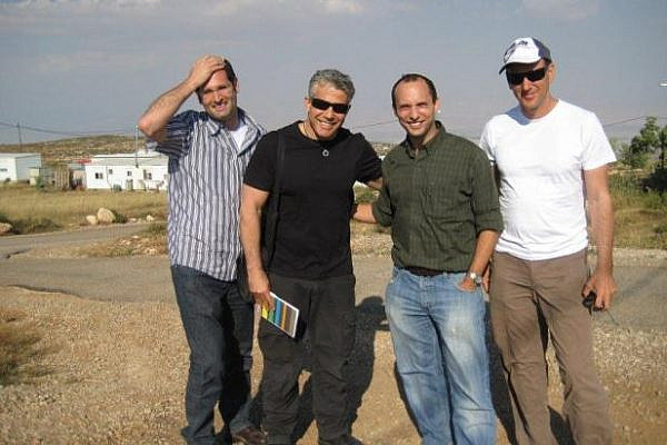 Yair Lapid (second from the left) and Naftali Bennett (to his left) at the West Bank outpost Kida (photo: Roi Sharon)