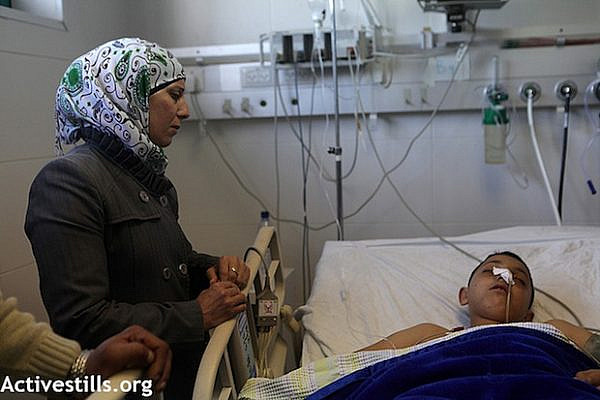 13 year-old Mohammad al-Kurdi from Aida refugee camp, in hospital suffering injuries from IDF fire