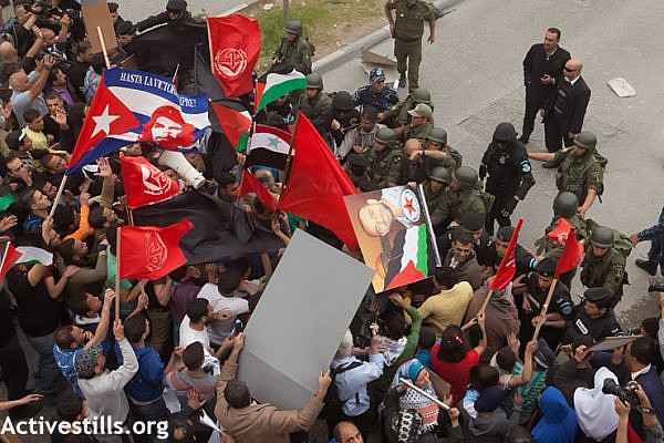Palestinian activists protest in Deheishe refugee camp against U.S. President Obama's visit to Bethlehem, West Bank, March 22, 2013. (Photo by: Anne Paq/Activestills.org)