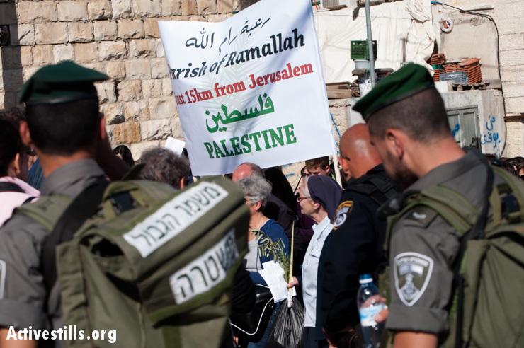 PHOTOS: Palestinian Christians protest Israeli permit regime during Palm Sunday procession