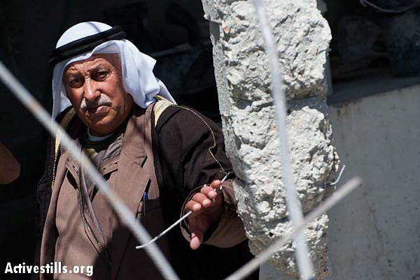 An elder of the Jaradat family stands in the remains of his home demolished by Israeli authorities. (photo: Ryan Rodrick Beiler/Activestills.org)