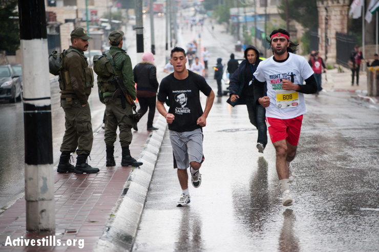 PHOTOS: First Palestine Marathon runs between walls in Bethlehem