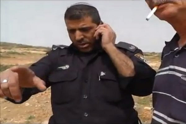 Policeman detaining Ta'ayush activists Screenshot