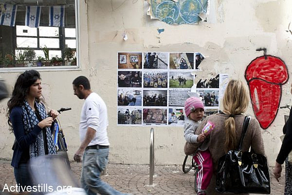 Activists put up a street photo exhibition in solidarity with the Palestinian prisoners in various locations in Tel Aviv, April 17, 2013.
