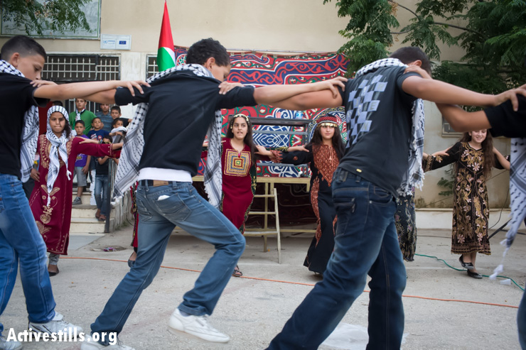 The Budrus youth dabke troupe performs at the graphic novel launch event. 