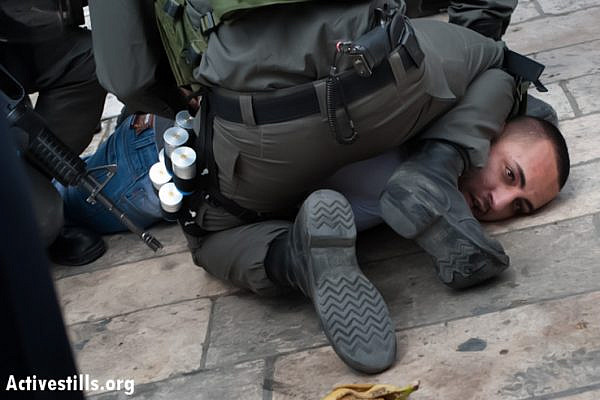Israeli police arrest a Palestinian man during protests commemorating Nakba Day at Damascus Gate, East Jerusalem, May 15, 2013. (Photo by: Ryan Rodrick Beiler/Activestills.org)