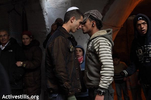 A Jew and a Palestinian face off (file photo, by Anne Paq/Activestills.org)