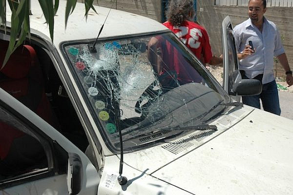 A car belonging to one of the Yesh Din personnel after it was attacked by settlers at Havat Gilad (photo: Yesh Din)