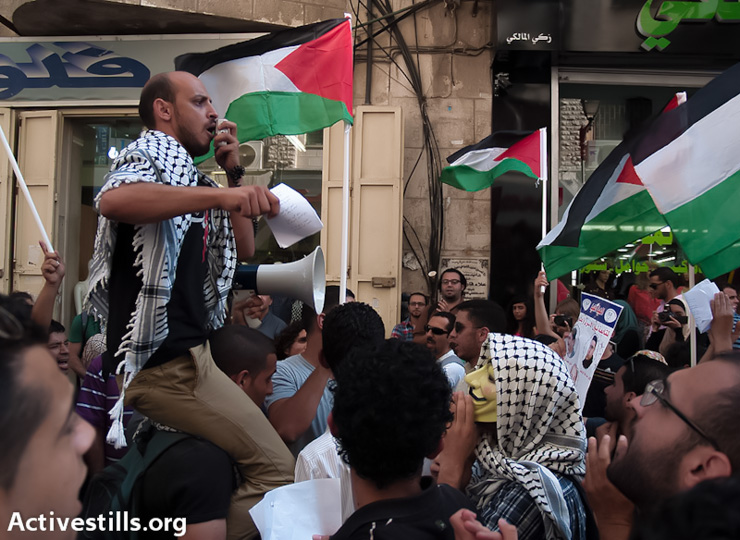 A demonstrator chants slogans against the Prawer Plan during a protest in Ramallah, West Bank on July 15, 2013. (Photo by guest photographer: Nidal Elwan/Activestills.org)