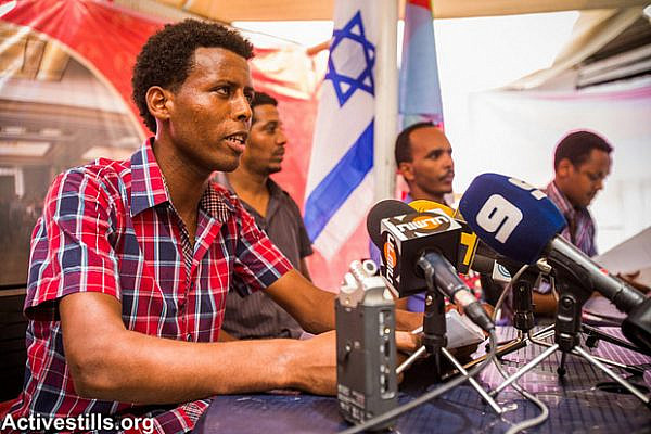 Eritrean activists speaking at the press conference, Tel aviv, July 28, 2013. (Yotam Ronen/Activestills.org)