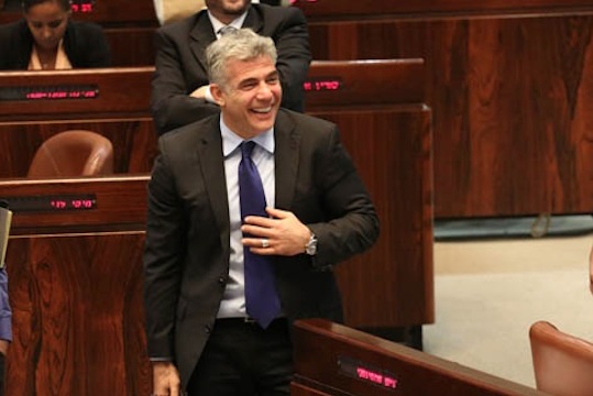 Then Finance Minister Yair Lapid in the Knesset, July 29, 2013 (Photo: Tali Mayer/ Activestills.org)