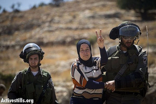 IDF arrests Nariman Tamimi at Nabi Saleh weekly protest June 28, 2013 (Activestills)