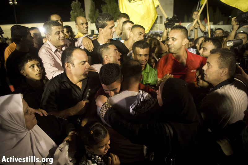 PHOTOS: Released Palestinian prisoners arrive home to West Bank