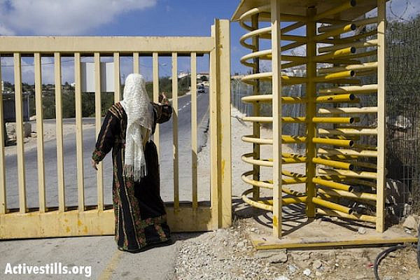 A Palestinian woman takes part in a demonstration against the Israeli army's permit regime, Bidu, West Bank, August 30, 2009. (Photo: Activestills.org)