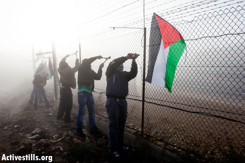 PHOTOS: Palestinians destroy separation barrier in two West Bank villages