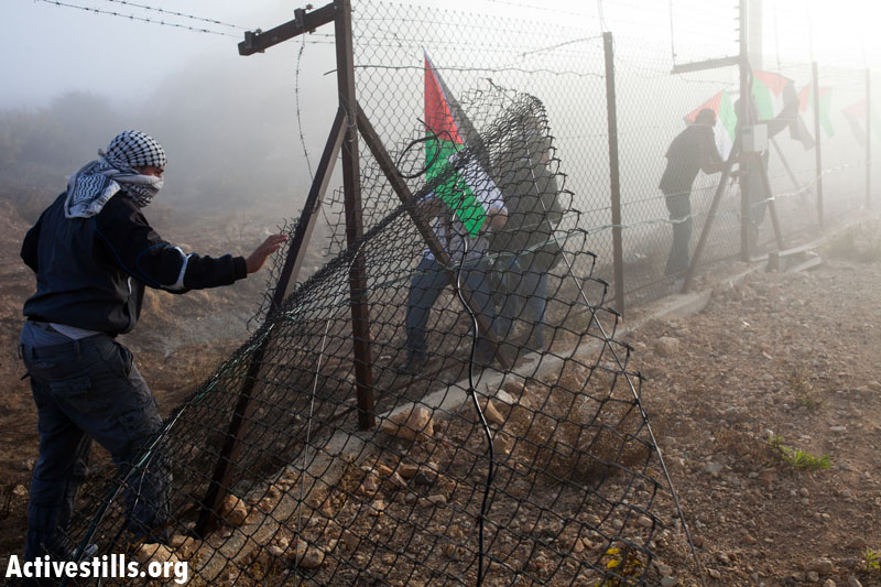 PHOTOS: Palestinians destroy separation barrier in two West Bank villages