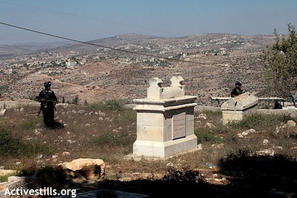 Illustrative file photo of IDF soldiers in a Palestinian cemetery. (Anne Paq/Activestills.org)