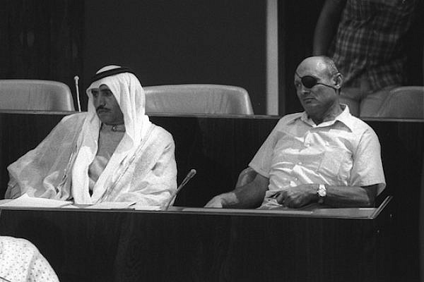 Then MK Moshe Dayan and Bedouin MK Sheikh Hamad Abu Rabia in the Knesset, September 3, 1975. (Photo: Moshe Milner/GPO)