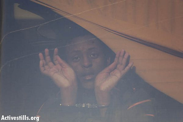 An asylum seeker detained by immigration police during the second "March for Freedom." (photo: Oren Ziv/Activestills.org)