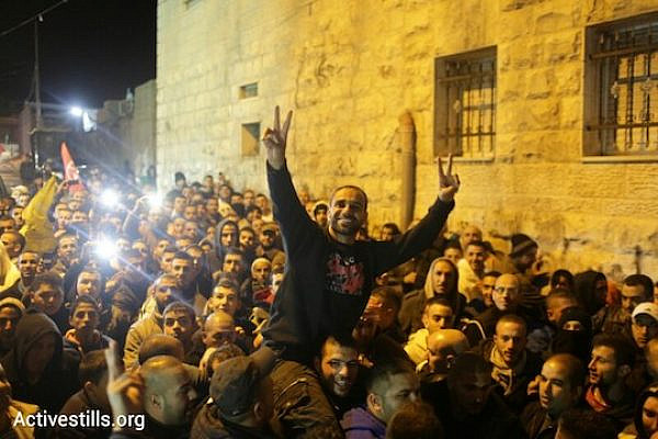 Former Palestinian hunger striker Samer Issawi arrives home in his East Jerusalem village of Issawiya, December 23, 2013. Issawi secured his freedom after staging an intermittent hunger strike for nearly nine months. (Photo: Oren Ziv/Activestills.org)