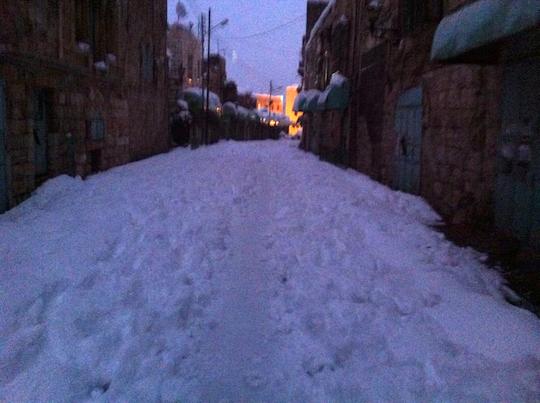 PHOTO: 'Snow makes everyone equal for a day on Hebron's Shuhada St.'