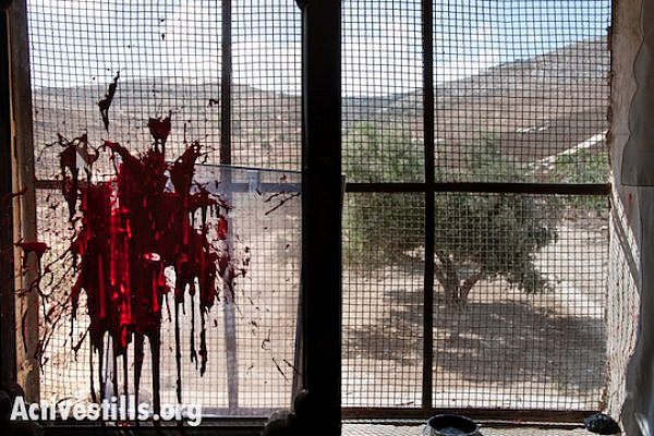 Red paint thrown during an attack by Israeli settlers on a Palestinian home in the West Bank village of Burin, October 9, 2012. (Photo: Ryan Rodrick Beiler/Activestills.org)