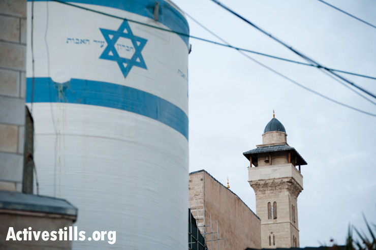 An Israeli settlement water tank stands near the Ibrahimi Mosque or Tomb of the Patriarchs in the West Bank city of Hebron. All settlements in the occupied Palestinian territories are illegal under international law.