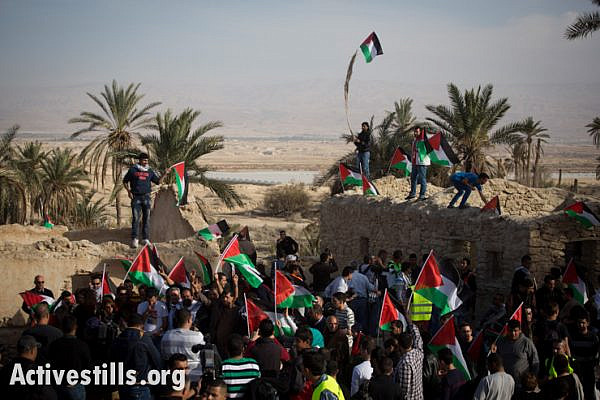 Palestinians shout slogans in the in Ein Hijleh protest village, in the Jordan Valley, West Bank January 31, 2014. Over 300 Palestinians participated in the action, as part of Melh Al-Ard (Salt of the Earth) campaign against the Israeli plans to annex the Jordan valley, discussed during the current round of negotiation-talks between the PA and Israel, coordinated by John Kerry.