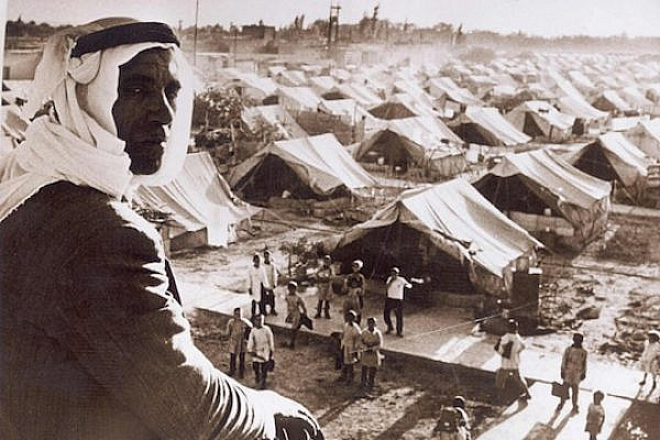 A Palestinian refugee looks over the Jaramana Refugee Camp in Damascus, 1948. (Author unknown)