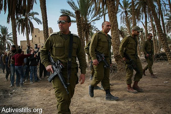 Israeli soldiers patrol in the the Ein Hijleh protest camp, Jordan Valley, West Bank, February 5, 2014. (photo: Hamde Abu Rahma/Activestills.org)