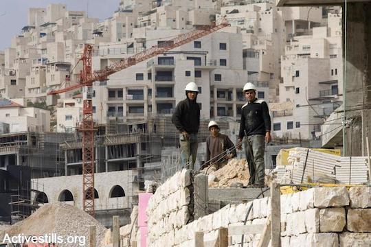 Palestinian construction workers in an Israeli settlement (Photo by Yotam Ronen/Activestills.org)