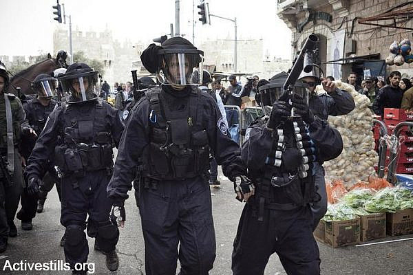 Israeli police dispersing a march in Damascus Gate, held to mark Land Day, which commemorates the killing of six Palestinians in Sakhnin in 1976, during a protest against land expropriation. (Photo by JC/Activestills.org)