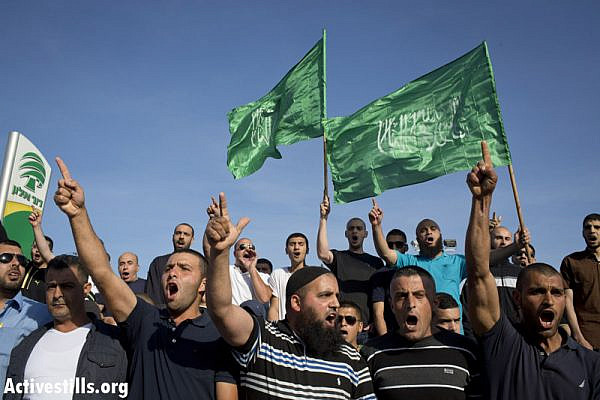 Palestinians protest at the entrance to the city of Umm al-Fahm, against the recent attack against a mosque in the city, April 21, 2014. On April 18, the door of a mosque in the city was set on fire and graffiti reading "Arabs out" was sprayed outside. (photo: Activestills.org)