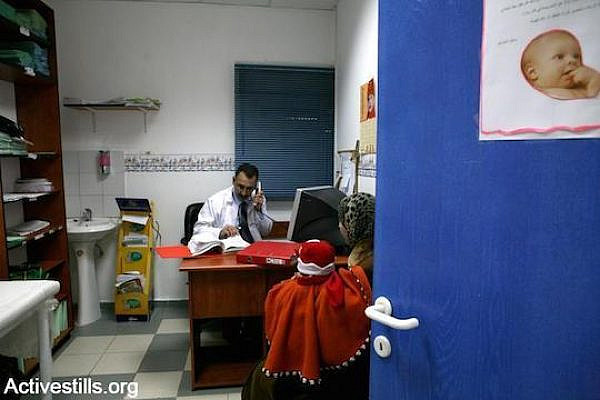 A Palestinian doctor at a clinic in the East Jerusalem neighborhood of Silwan. (Photo by Activestills.org)