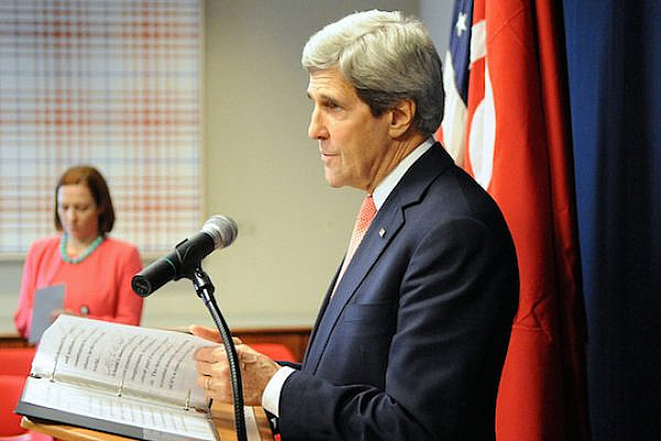 File photo of U.S. Secretary of State John Kerry, with State Department Spokesperson Jen Psaki in the background, conducting a press conference, February 18, 2014.(Photo: State Dept.)