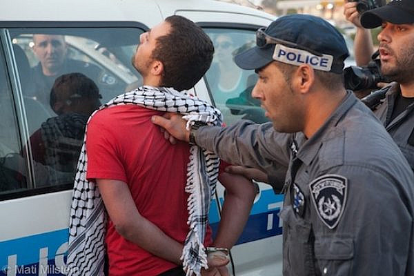 Police arrest a Palestinian citizen of Israel during a 2012 protest in Ramle. (photo: Mati Milstein)