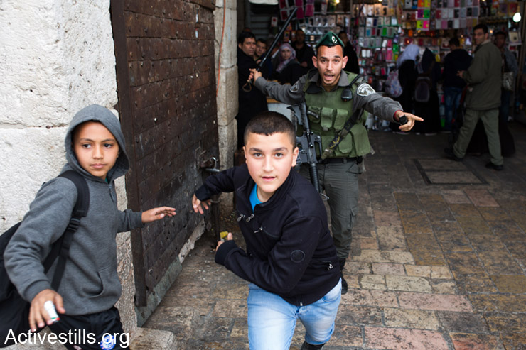 Israeli border police officer chases Palestinian children during land day demonstration in Damascus gate, East Jerusalem on 30 , March 2014 Land Day is held on the anniversary of March 30, 1976, when Palestinian villages and cities across the country witnessed mass demonstrations against the state's plans to expropriate 2,000 hectares of land in Israel's Galilee region. In coordination with the military, some 4,000 police officers were dispatched to quell the unrest. At the end of the day, six Palestinian citizens of Israel were killed by state security forces.