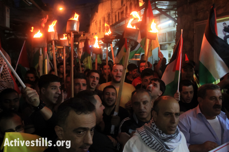 Palestinians demonstrate on the 66th anniversary of the Nakba in the West Bank city of Nablus, May 14, 2014.