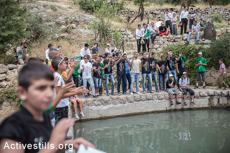 Palestinians celebrate during a festival by a natural spring at Lifta, on May 16, 2014 in Jerusalem. Palestinians came to mark the Nakba day. Lifta was a Palestinian village that was destroyed after the establishment of Israel. (Activestills.org)